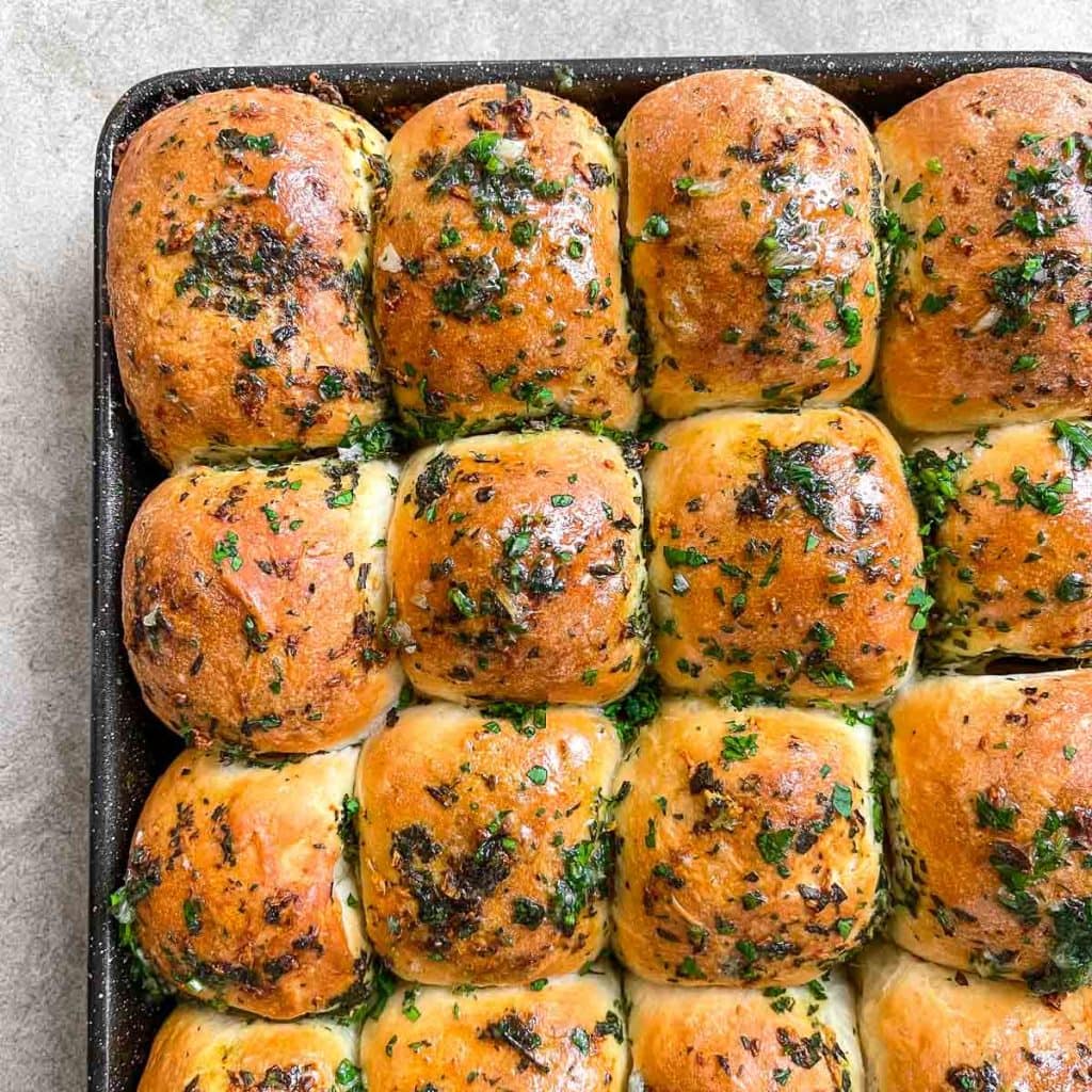 Soft, pillowy garlic rolls, brushed with garlic herb butter.