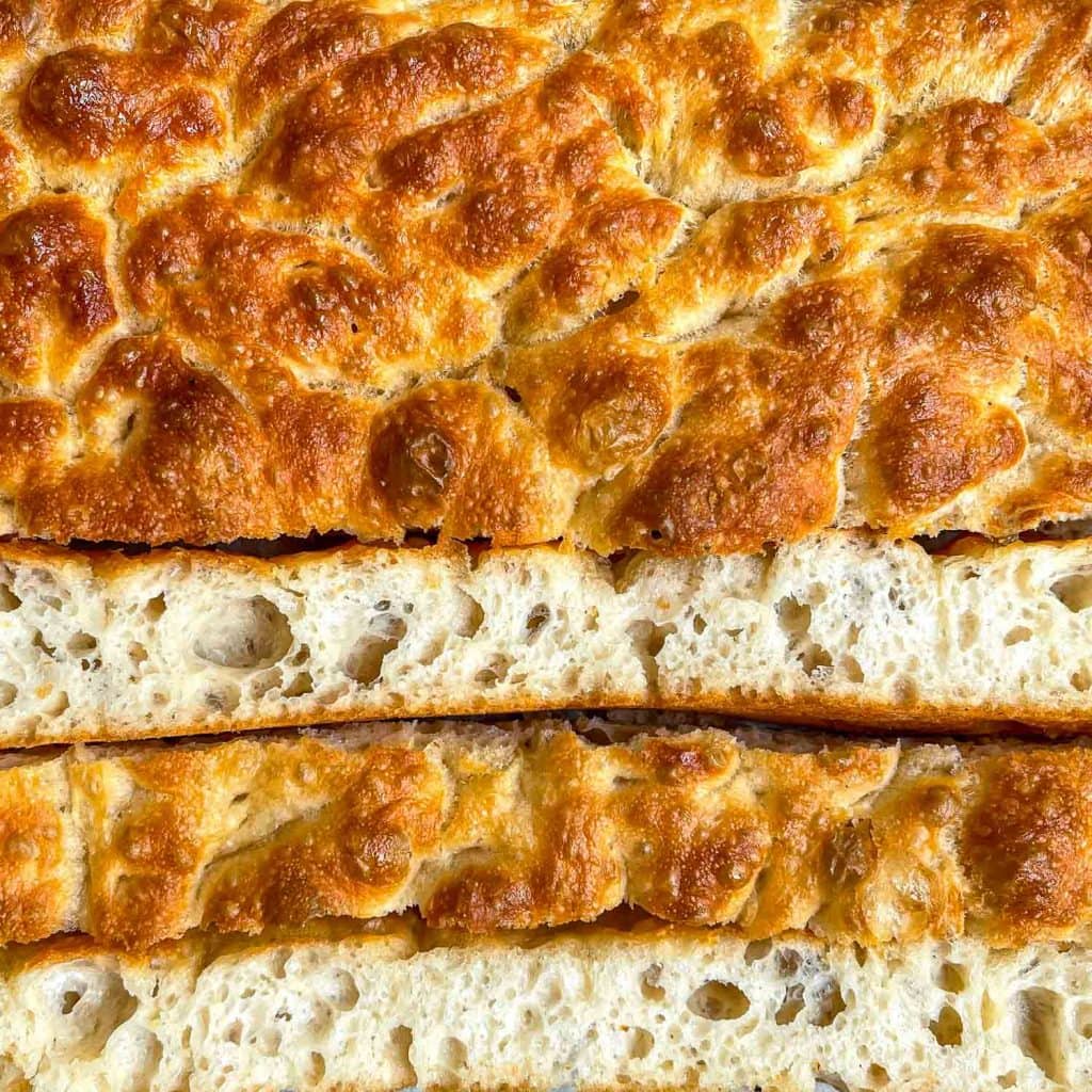 A close-up of the golden brown no-knead focaccia.