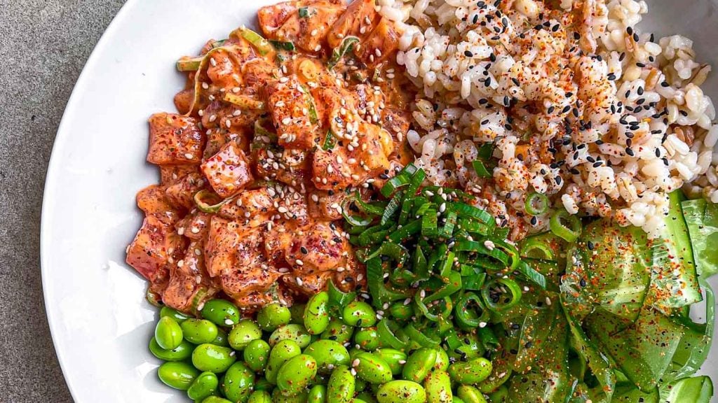 Spicy tuna poke bowl, with edamame, cucumber and spring onion.