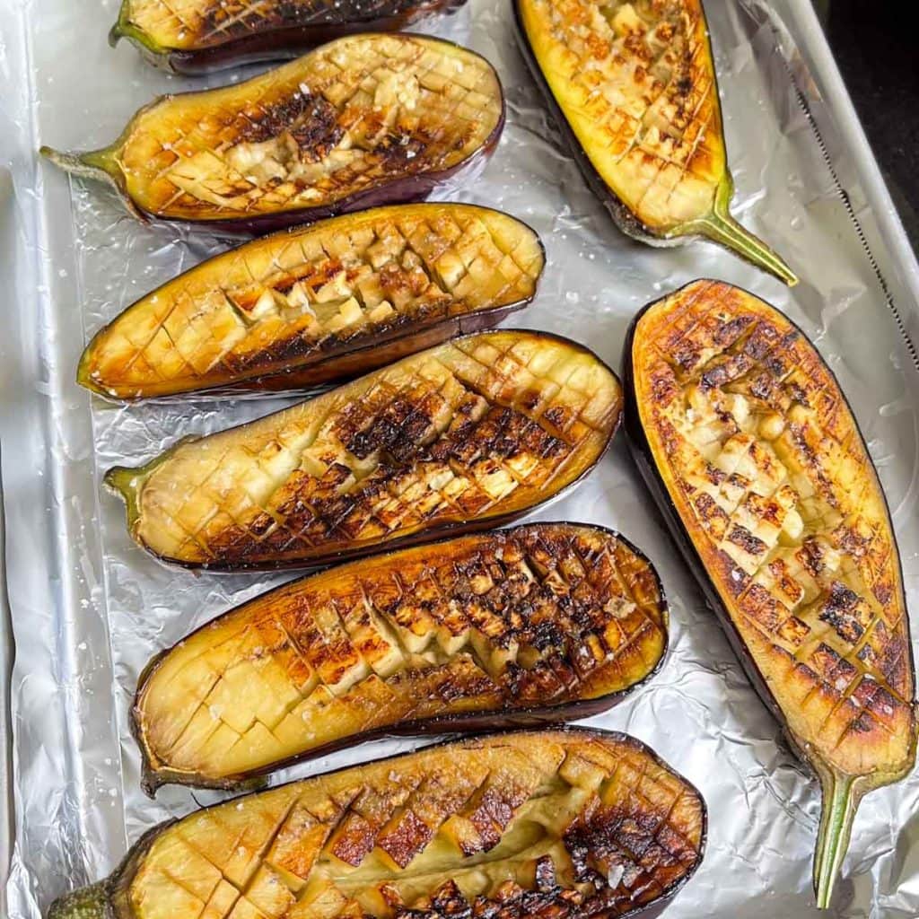Seared aubergines on a baking tray