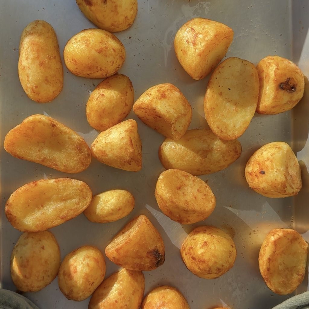 Crispy roast potatoes, fresh out of the oven. 