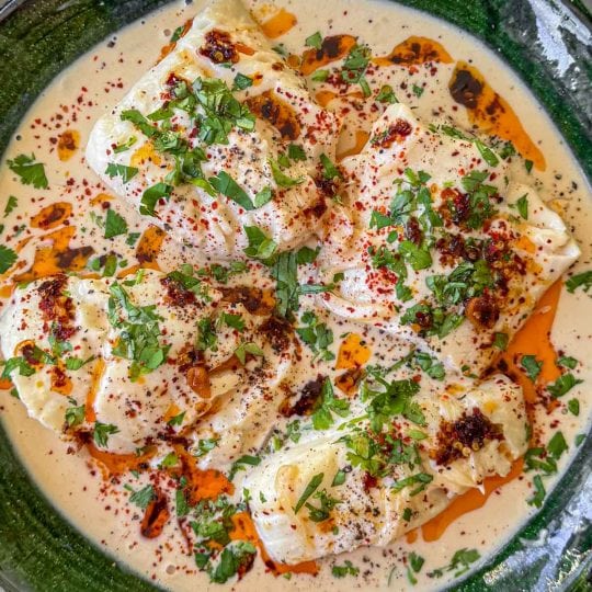 Coconut miso poached fish, topped with chilli oil and fresh coriander.