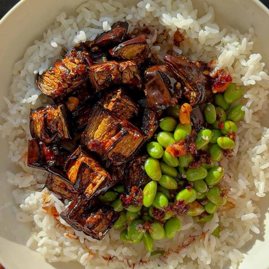 Teriyaki aubergine, served with edamame and rice.