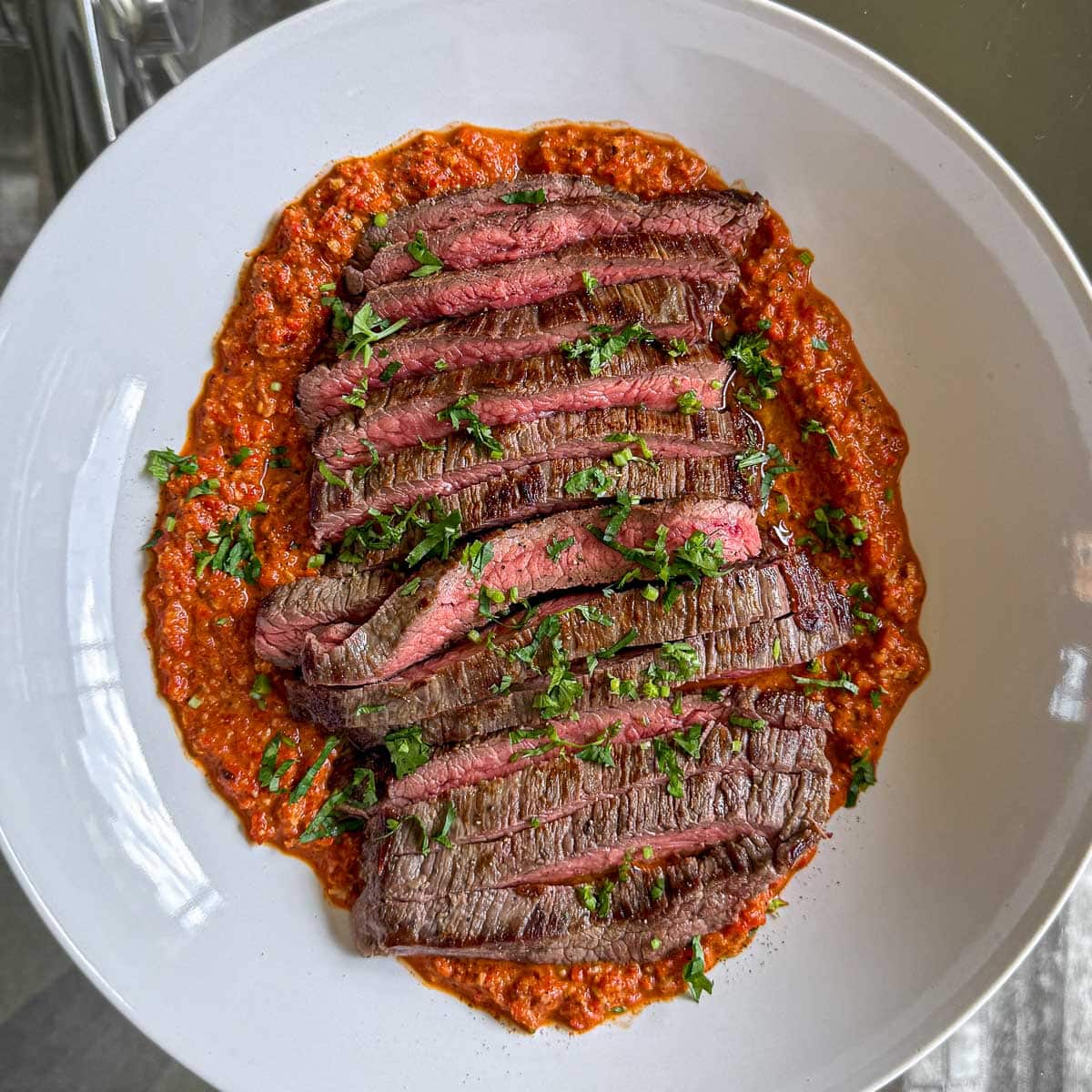Marinated flank steak, cooked medium-rare and served over a cheat's muhammara.
