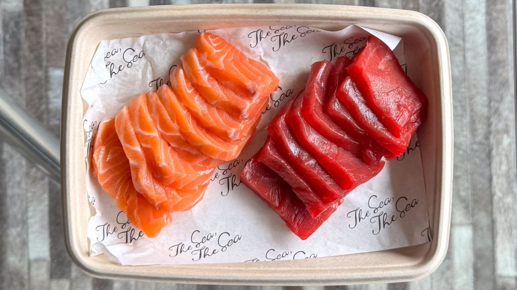 A tray of raw sushi grade salmon and tuna.
