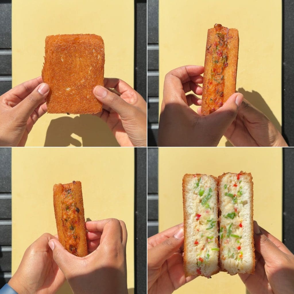 Cutting into the fish and prawn toast.