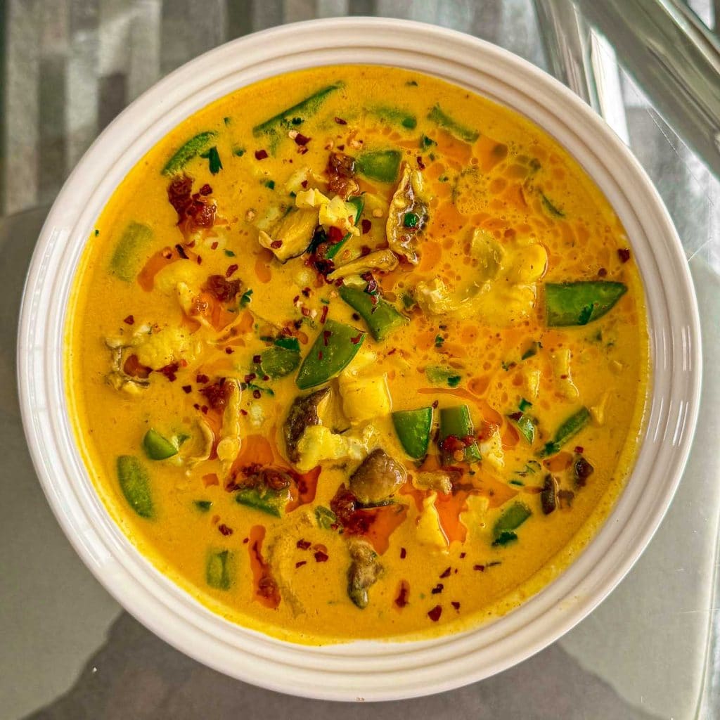 An overhead shot of the Thai curry fish soup.