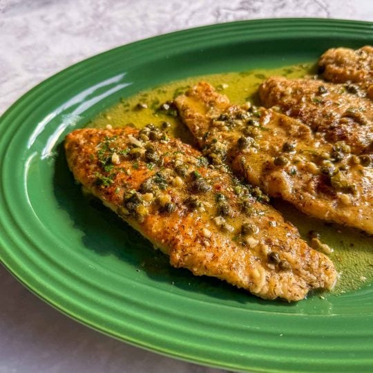 Fish fillet coated in za’atar with lemon butter sauce spooned over the top