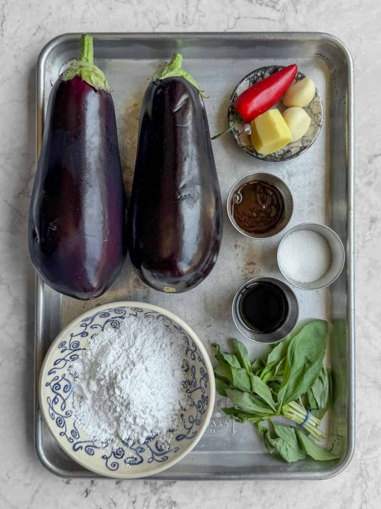 Ingredients for crispy Thai aubergine including aubergines, tapioca flour, oyster sauce, fish sauce and Thai basil