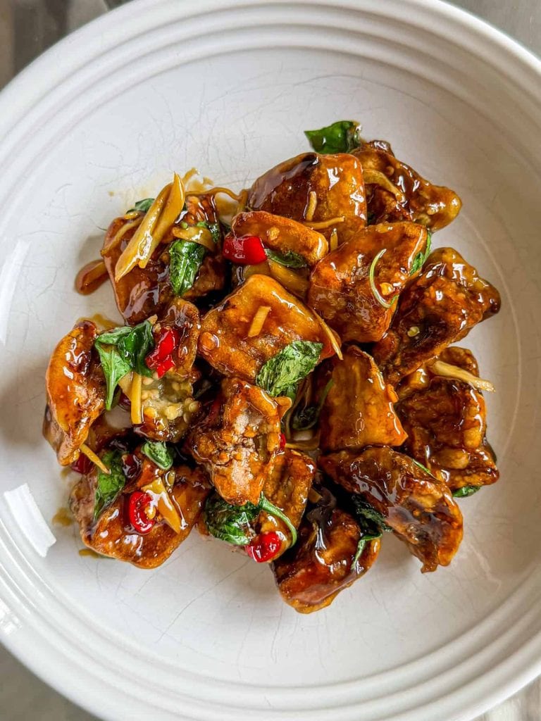 Close-up of crispy Thai aubergine showing the crunchy coating and glossy sauce