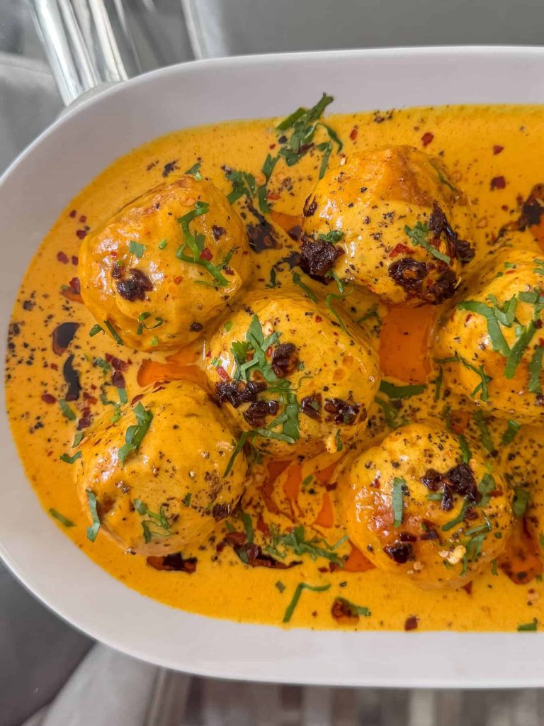 Thai curry chicken meatballs, topped with chopped coriander