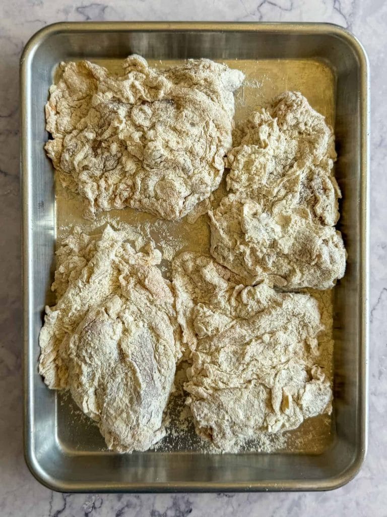 Tom yum brined chicken thighs, double coated in flour
