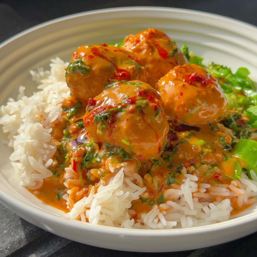 Photo of the finished dish, served with rice and broccoli.